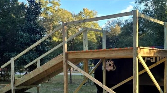 Completed wooden accessibility ramp and platform