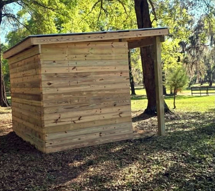 Front view of a newly built wooden run-in shelter